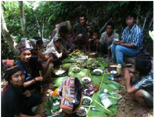 Members of the 5 family coffee group having a meal together on site of improving water supply at their coffee processing place. Te Cheh is right in the center in the back and his wife, Che Cha is the second from the left. 